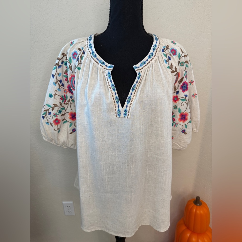 Umgee peasant-style blouse with floral embroidery on the sleeves and neckline. L